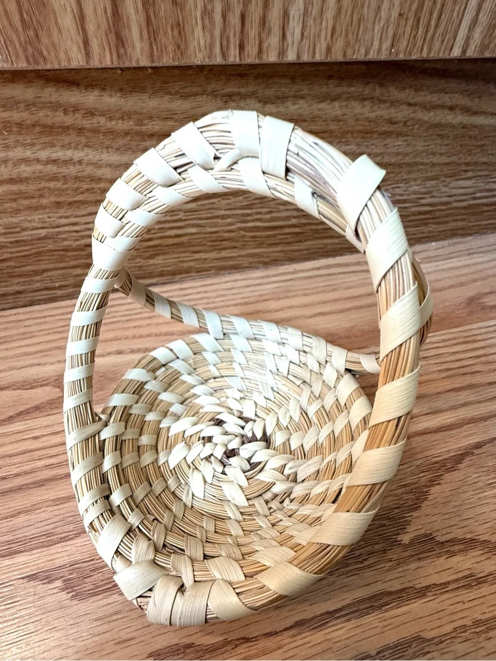 Atraditional hand-woven sweetgrass basket
